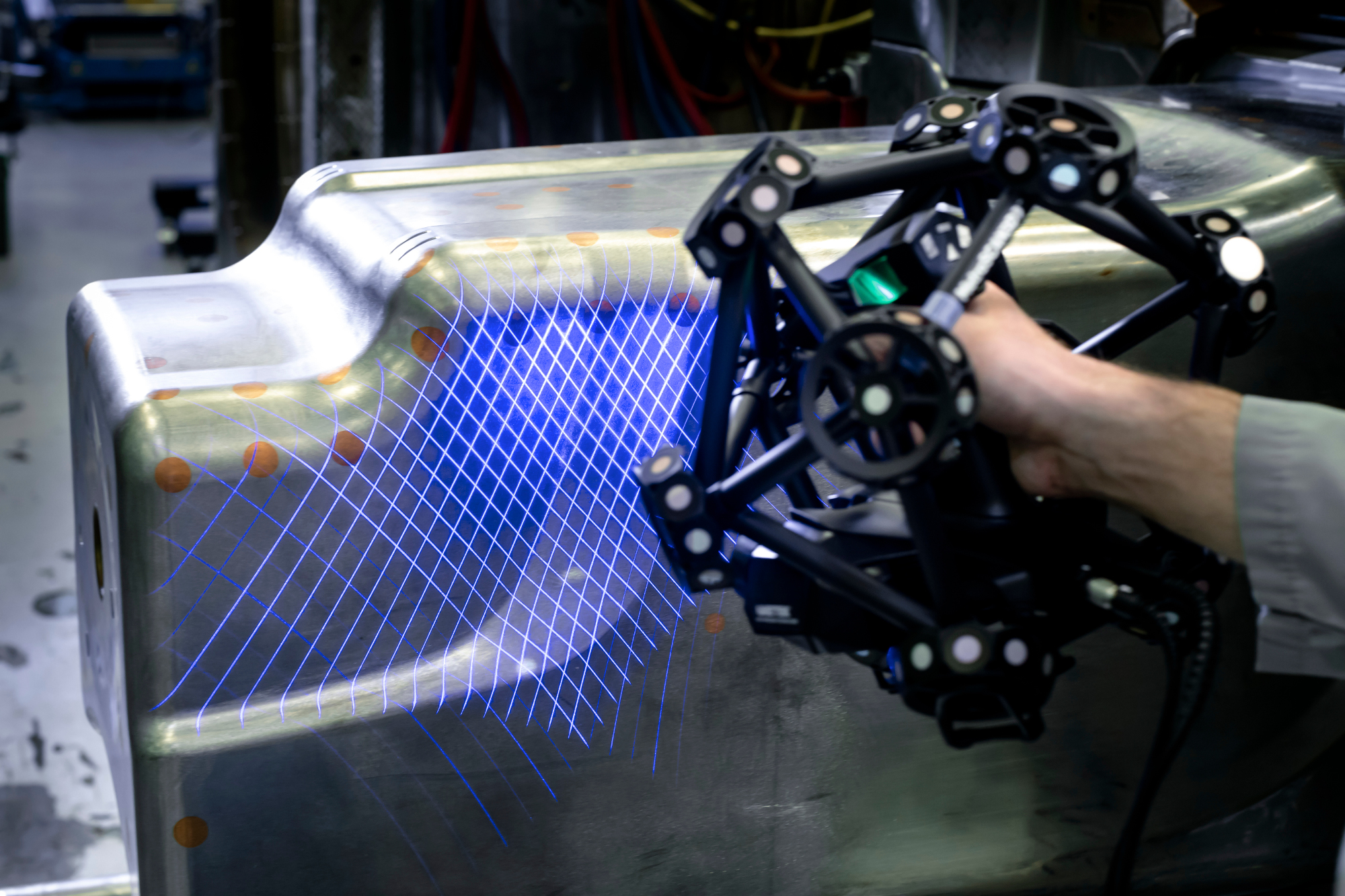 Blue-light handheld laser scanning at 25-micron accuracy